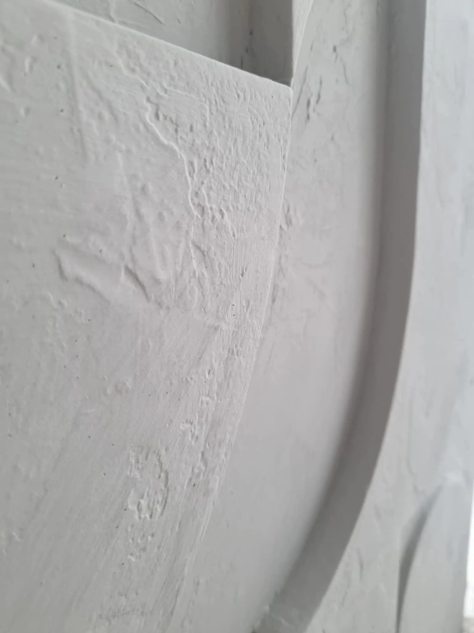 sculptural handmade 3d plaster wall hanging for living room above sofa